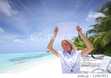 business woman with blank paper on the ocean coast business woman with blank paper on the ocean coast 11007053