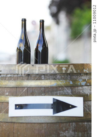 Wine bottles on wodden barrel Wine bottles on wodden barrel 11009012