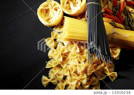 Pasta ingredients on black table Pasta ingredients on black table 11010238