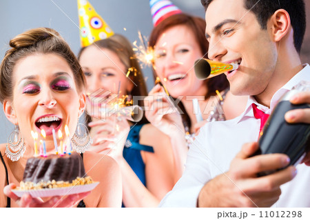 Friends having birthday celebration Friends having birthday celebration 11012298