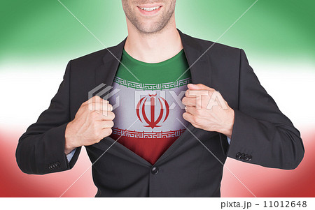 Businessman opening suit to reveal shirt with flag Businessman opening suit to reveal shirt with flag 11012648