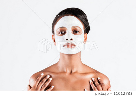 Beautiful African woman in Studio with facial mask Beautiful African woman in Studio with facial mask 11012733