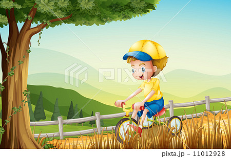 A young boy playing with his bike A young boy playing with his bike 11012928