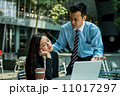 Business man and business woman in discussion 11017297