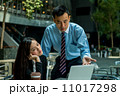 Business man and business woman in discussion 11017298