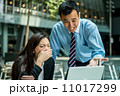 Business man and business woman in discussion 11017299