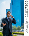 Confident businessman with phone 11017309