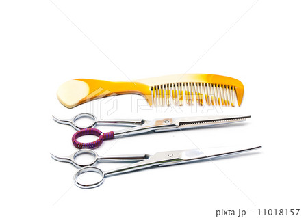 Close-up of two combs with scissors 11018157