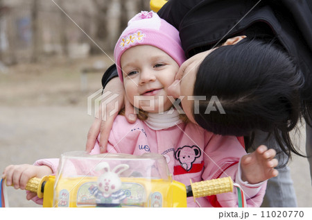 little girl sitting on a bike kissed my mother little girl sitting on a bike kissed my mother 11020770