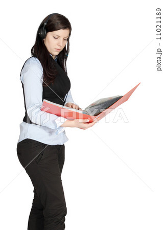Young woman with a headset and documents 11021189