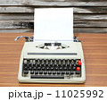 typewriter with blank paper and wood background 11025992