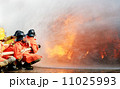 Firefighters fighting fire during training 11025993