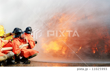 Firefighters fighting fire during training 11025993