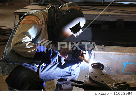 Industrial worker welding in factory 11025994