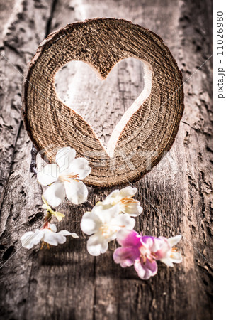 Light  heart on rustic wooden background 11026980