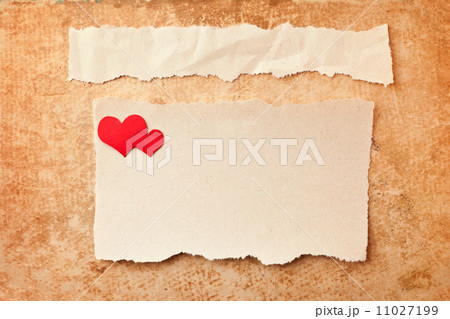 Ripped pieces of paper on grunge paper background. Love letter Ripped pieces of paper on grunge paper background. Love letter 11027199