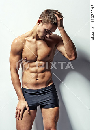 Young muscular man with headache 11029598