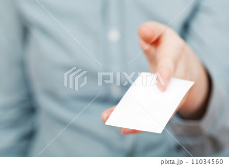 white business card in between female fingers white business card in between female fingers 11034560