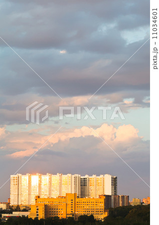 large urban house lit by sunset light in summer 11034601