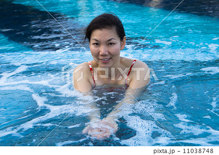 Asian woman enjoy and relaxing in spa pool on vacation Asian woman enjoy and relaxing in spa pool on vacation 11038748