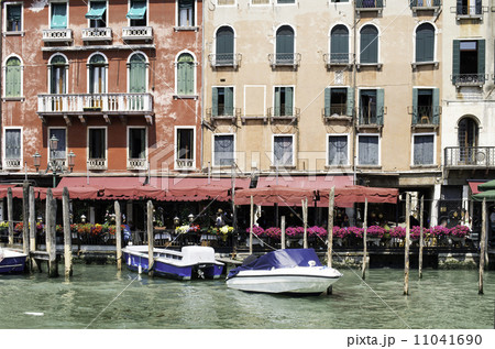 Ancient buildings and boats in the channel in Venice 11041690