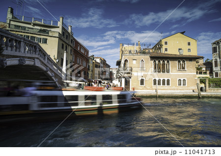 Ancient buildings and boats in the channel in Venice Ancient buildings and boats in the channel in Venice 11041713
