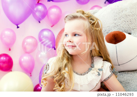 Smiling pretty blonde girl posing in playroom Smiling pretty blonde girl posing in playroom 11046293