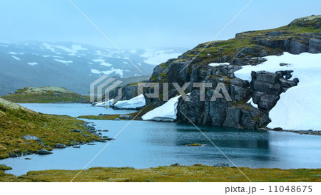 Summer mountain with lake and snow (Norway) Summer mountain with lake and snow (Norway) 11048675