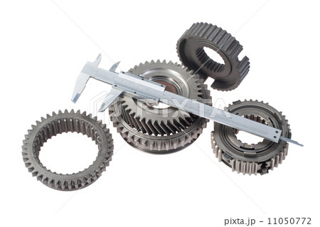 cog wheels with vernier calipers isolated on white background cog wheels with vernier calipers isolated on white background 11050772