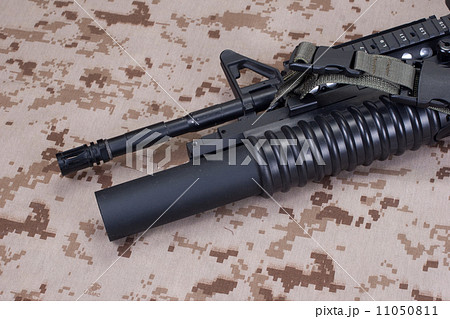 m4 carbine on camouflage uniform 11050811