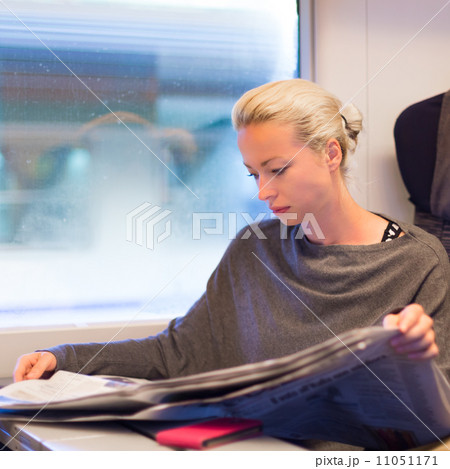 Lady traveling by train. 11051171