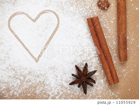 Heart shape on flour with spices Heart shape on flour with spices 11055929