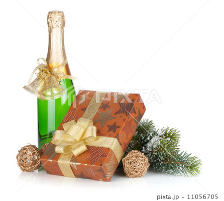 Champagne bottle, christmas gift box, decor and fir tree Champagne bottle, christmas gift box, decor and fir tree 11056705