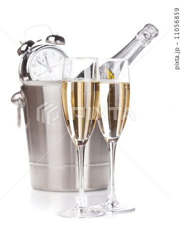 Two champagne glasses, bottle in bucket and alarm clock 11056859