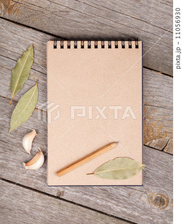 Blank notepad on wooden table 11056930