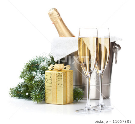 Champagne bottle in ice bucket, two glasses and christmas gift Champagne bottle in ice bucket, two glasses and christmas gift 11057305