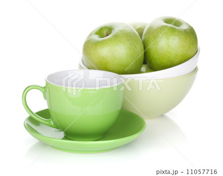 Green apples in fruit bowl and tea cup 11057716