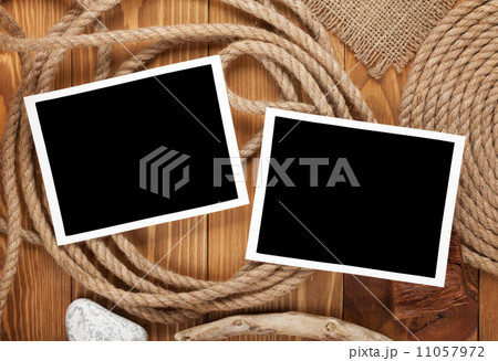 Travel photo frames on wooden texture Travel photo frames on wooden texture 11057972