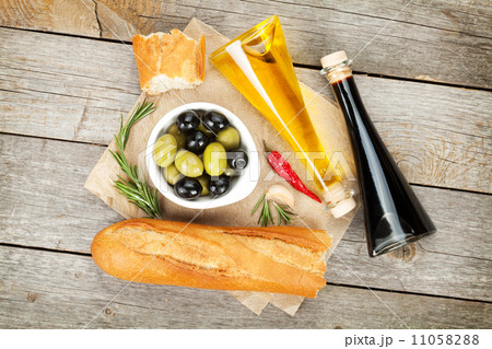 Italian food appetizer of olives, bread and spices Italian food appetizer of olives, bread and spices 11058288