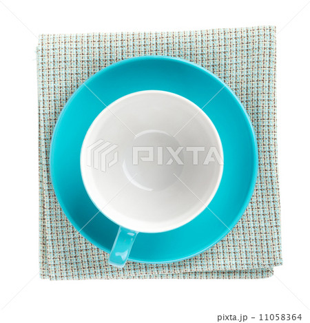 Blue coffee cup over kitchen towel Blue coffee cup over kitchen towel 11058364