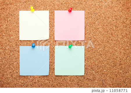 Blank postit notes on cork notice board 11058771