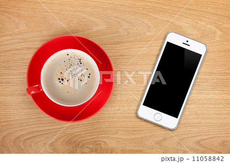 Mobile phone and coffee cup Mobile phone and coffee cup 11058842