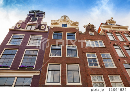 Living houses facades with blue sky. Amsterdam, Netherlands 11064625