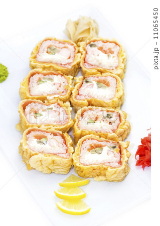Japanese rolls in a restaurant with fish and vegetables Japanese rolls in a restaurant with fish and vegetables 11065450