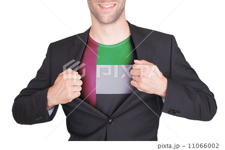 Businessman opening suit to reveal shirt with flag 11066002