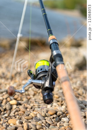 Modern clean fishing rod outdoors 11068053