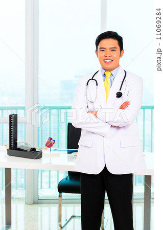 Asian doctor in office or medical surgery 11069284