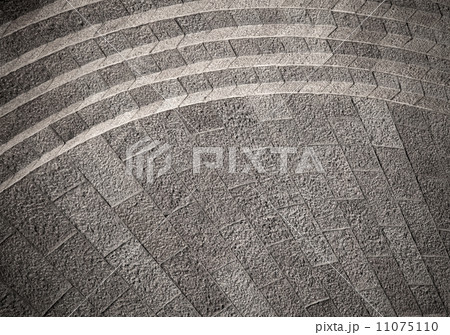 Abstract granite structure with curved footsteps 11075110