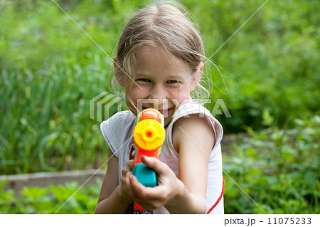 small girl with toy water gun small girl with toy water gun 11075233