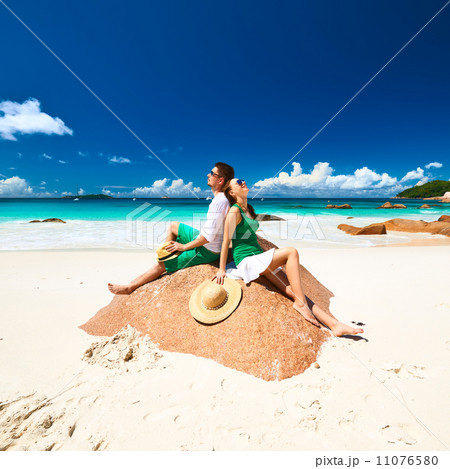 Couple in green on a beach at Seychelles Couple in green on a beach at Seychelles 11076580